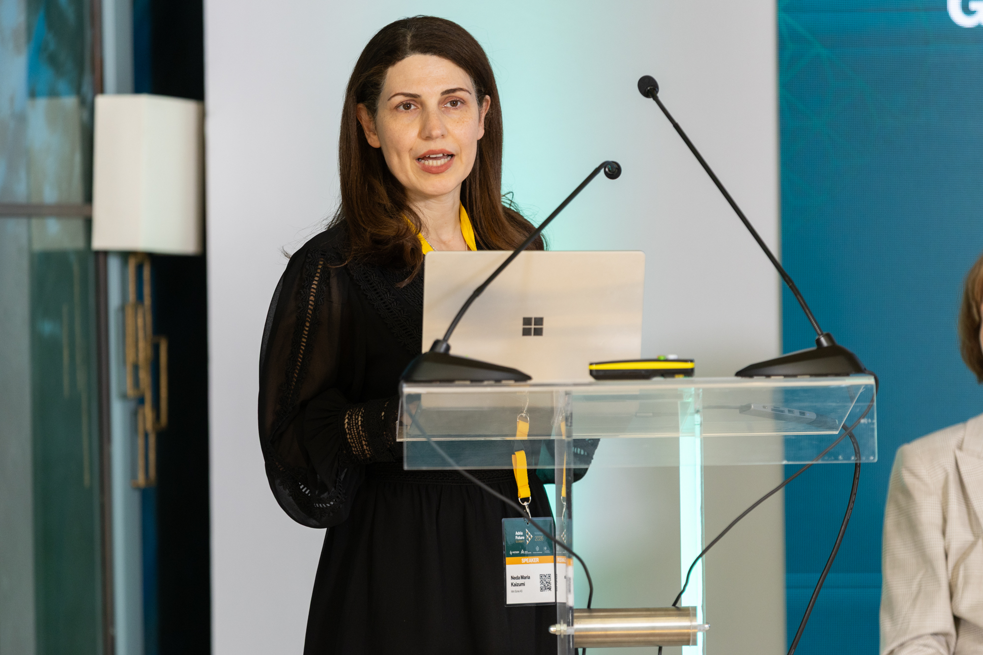 Dr. Neda Maria Kaizumi speaking to international audiences