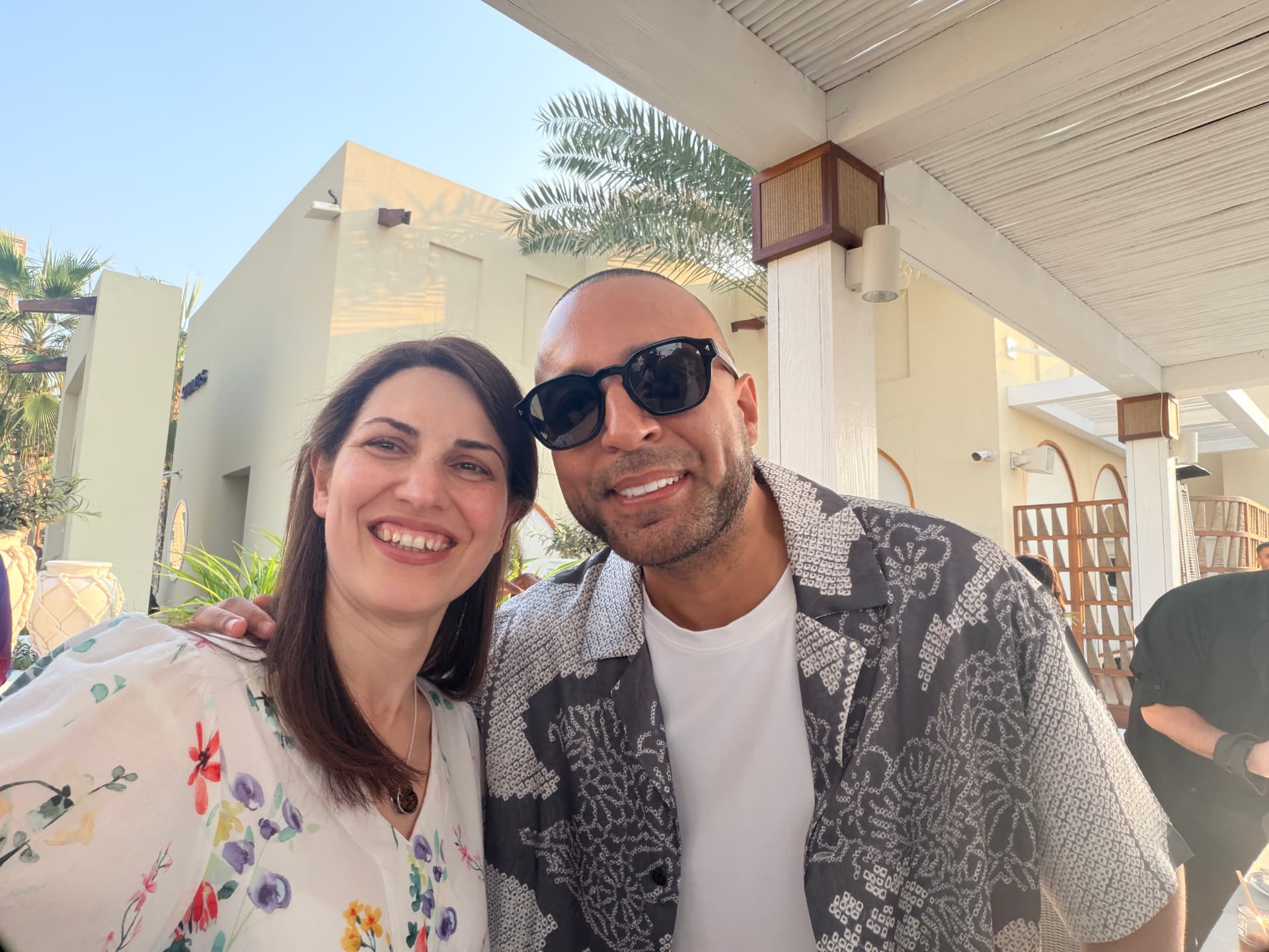 Dr. Neda Maria Kaizumi networking at an international summit